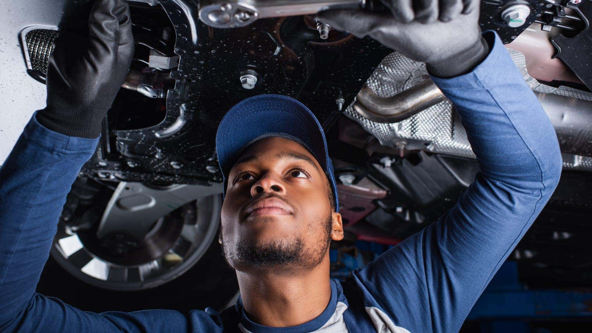 man working on vehicle