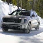 2026 Kia Sorento in grey driving in snow