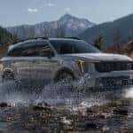 2026 Kia Sorento in grey driving in water