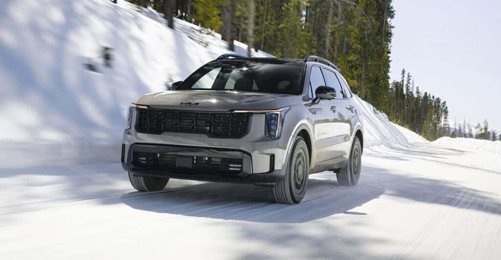 2026 Kia Sorento in grey driving in snow