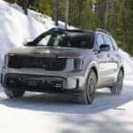2026 Kia Sorento in grey driving in snow