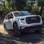 2026 Acadia white off roading on dirt road