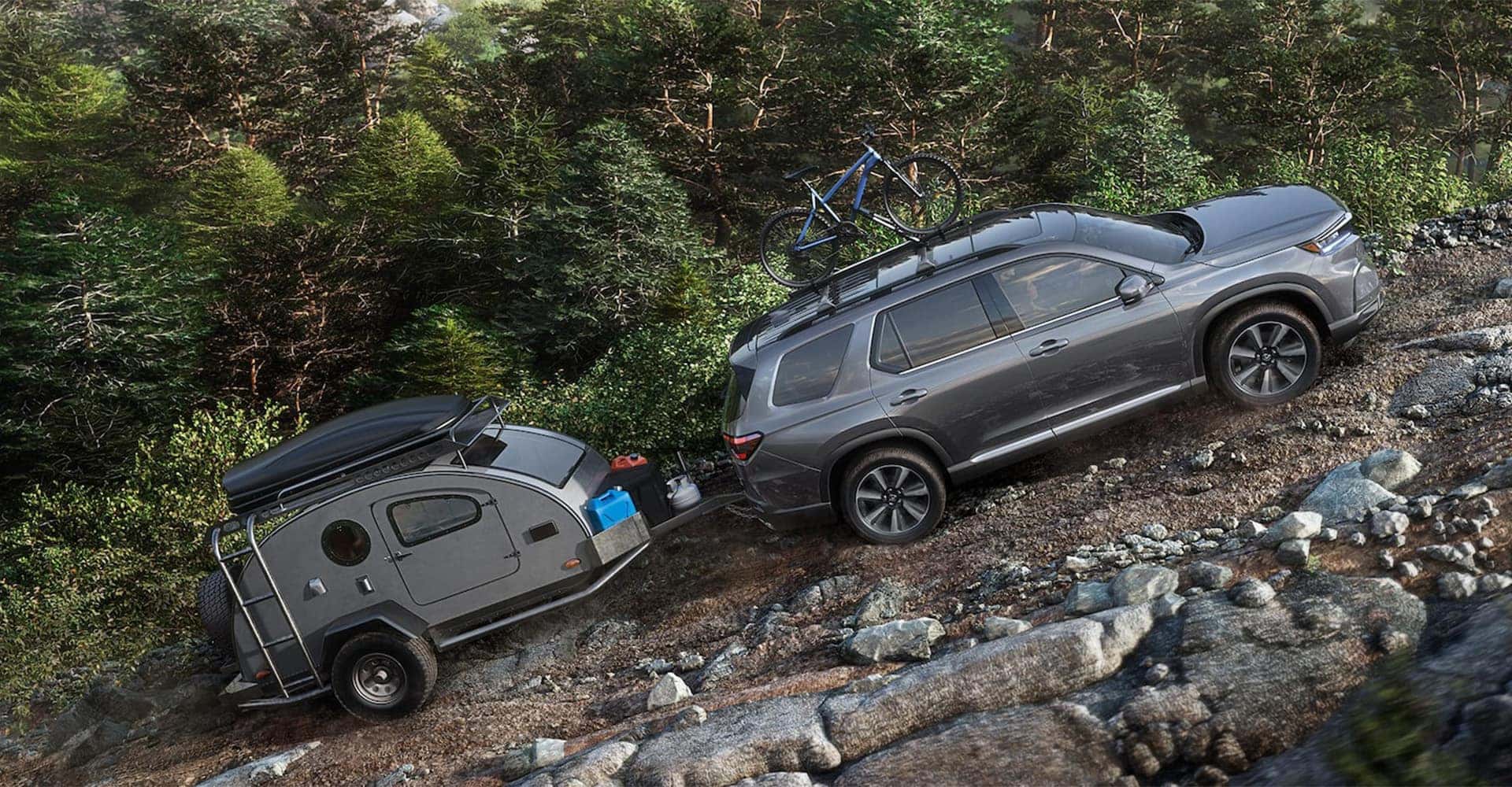 2025 Honda Pilot carrying trailer up hill