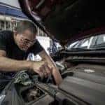 Man repairing car