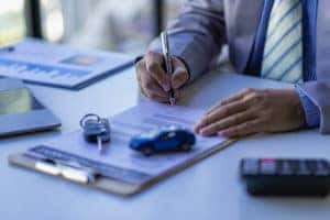 signing paperwork and car buying tips 2023