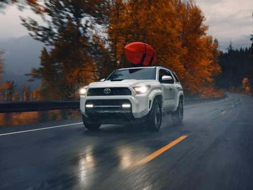 2025 Toyota 4Runner driving on a wet road