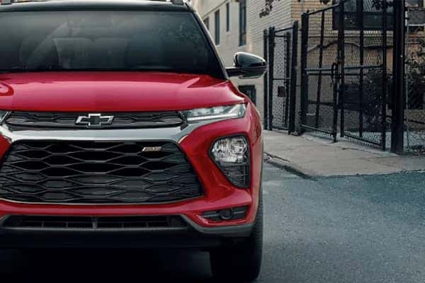 An exterior shot of three cars