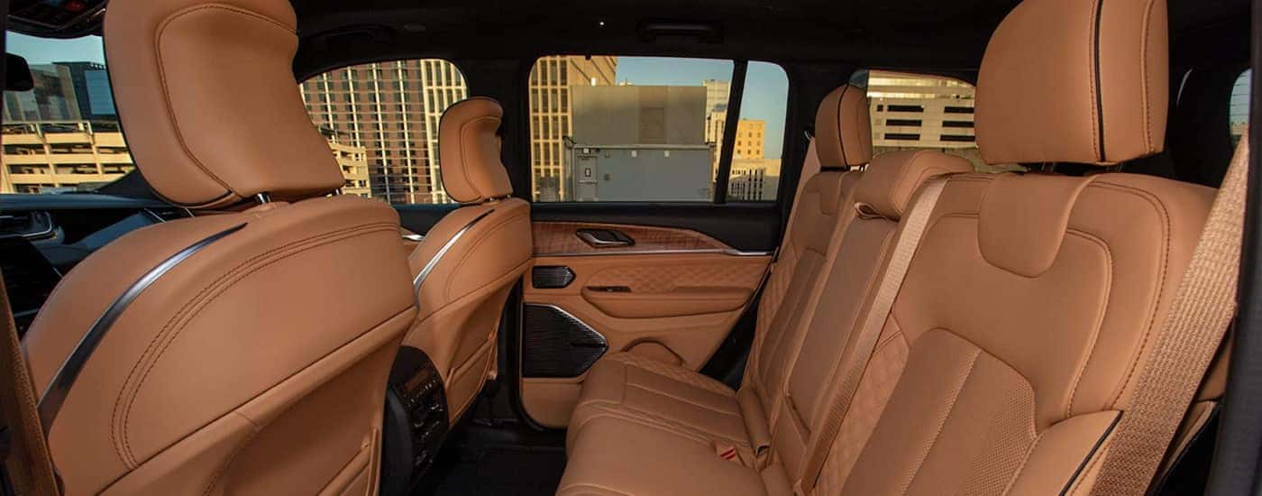 Side angle view of the brown interior seating of a 2025 Jeep Grand Cherokee.