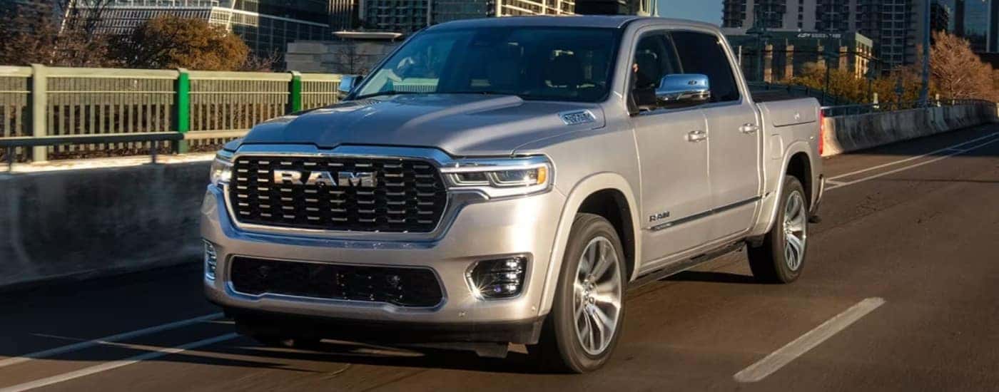 A silver 2025 Ram 1500 from the front at an angle.