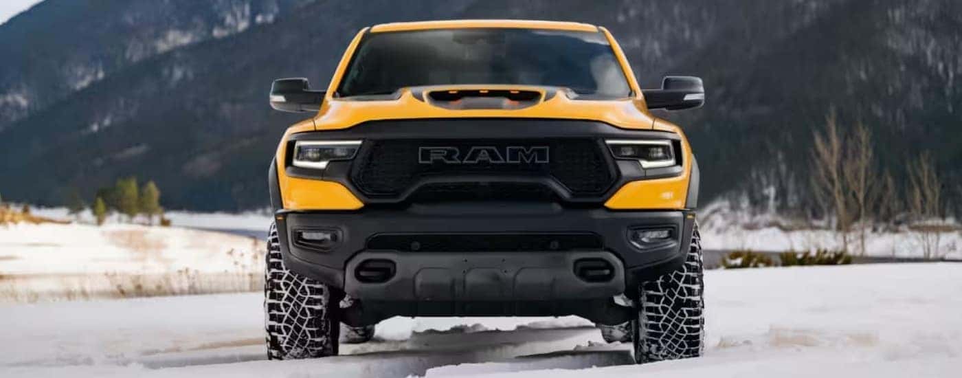 A yellow 2023 Ram 1500 TRX Havoc Edition parked off-road.