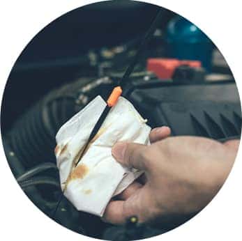 Difference between synthetic oil & conventional oil at Washington Honda | Honda Technician cleans off dipstick with towel