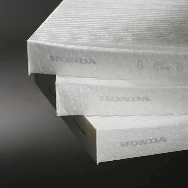 3 Main Benefits of Using OEM parts for your vehicle at Washington Honda in Washington, PA | 3 Honda Genuine Parts Cabin Filters Stacked on Top of Each Other Displaying the Honda Logo on a Gray Background