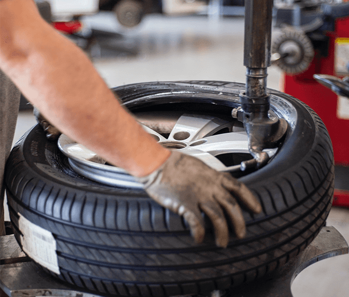 How to Get Your Car Summer Ready at Washington Honda in Washington, PA | New tires being installed by mechanic using tire machine