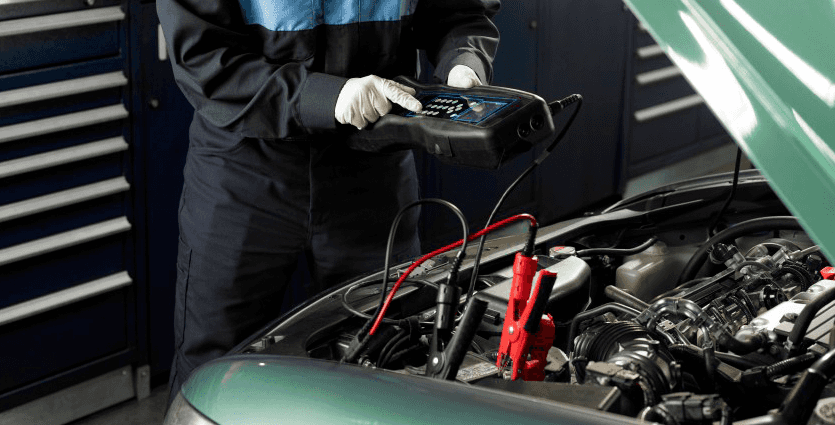 Everything You Need to Know about Your Car Battery at Washington Honda | Honda mechanic testing the battery life with special tool
