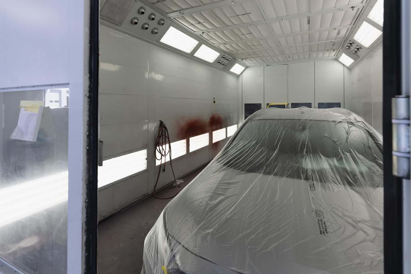 technician sprays car green